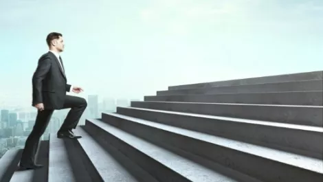 Success man suit stair yo